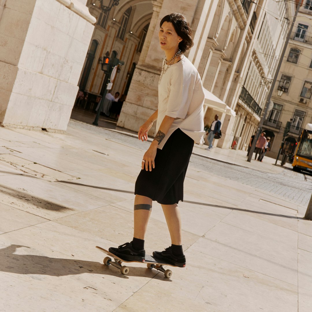 A young man skate boarding wearing an Oura Ring