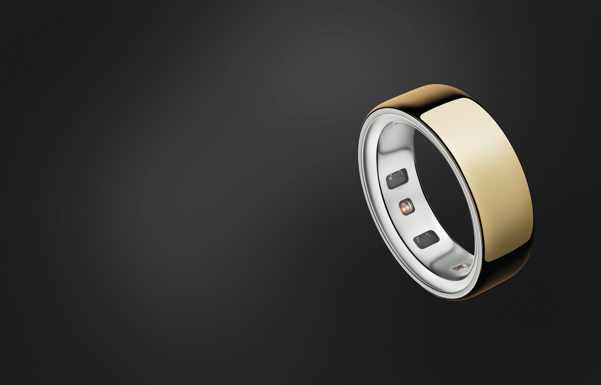 A hand wearing an Oura Ring pointing at a piece of paper.